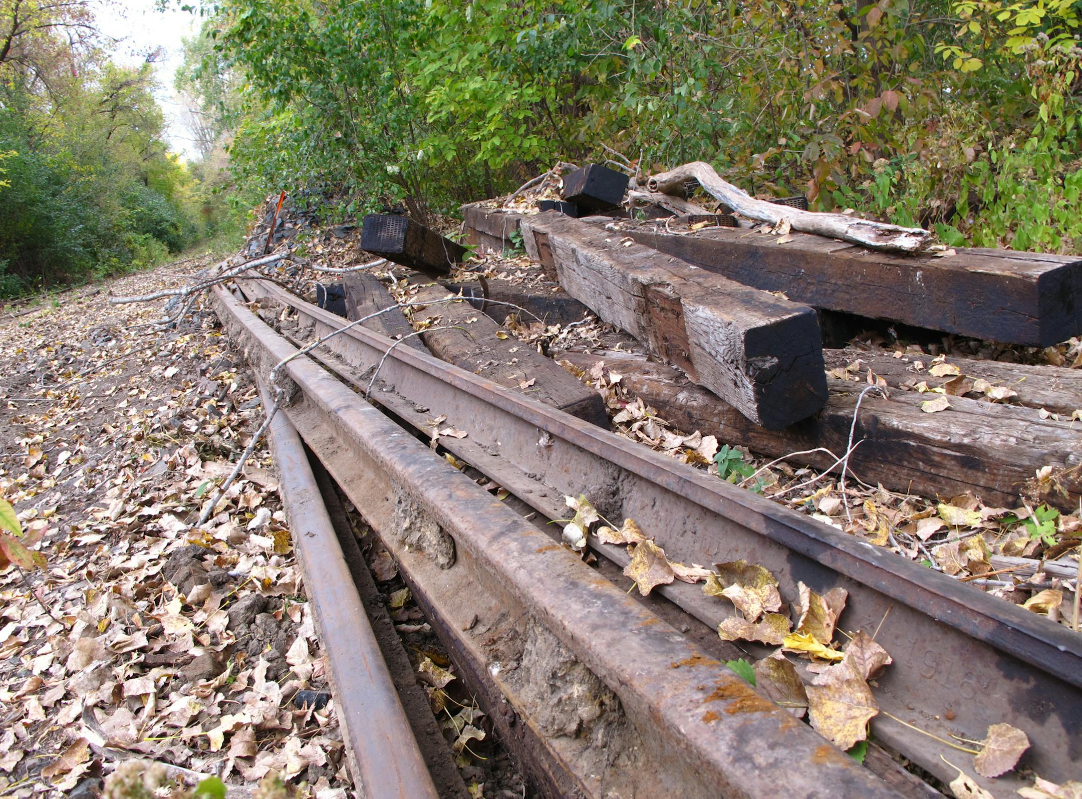 Photo by Kevin Giles Headline: End of the line Rails that once carried the Minnesota Zephyr dinner train from Stillwater west to Grant have been removed in preparation for the new Browns Creek State Trail. ORG XMIT: MIN1210011656400864
