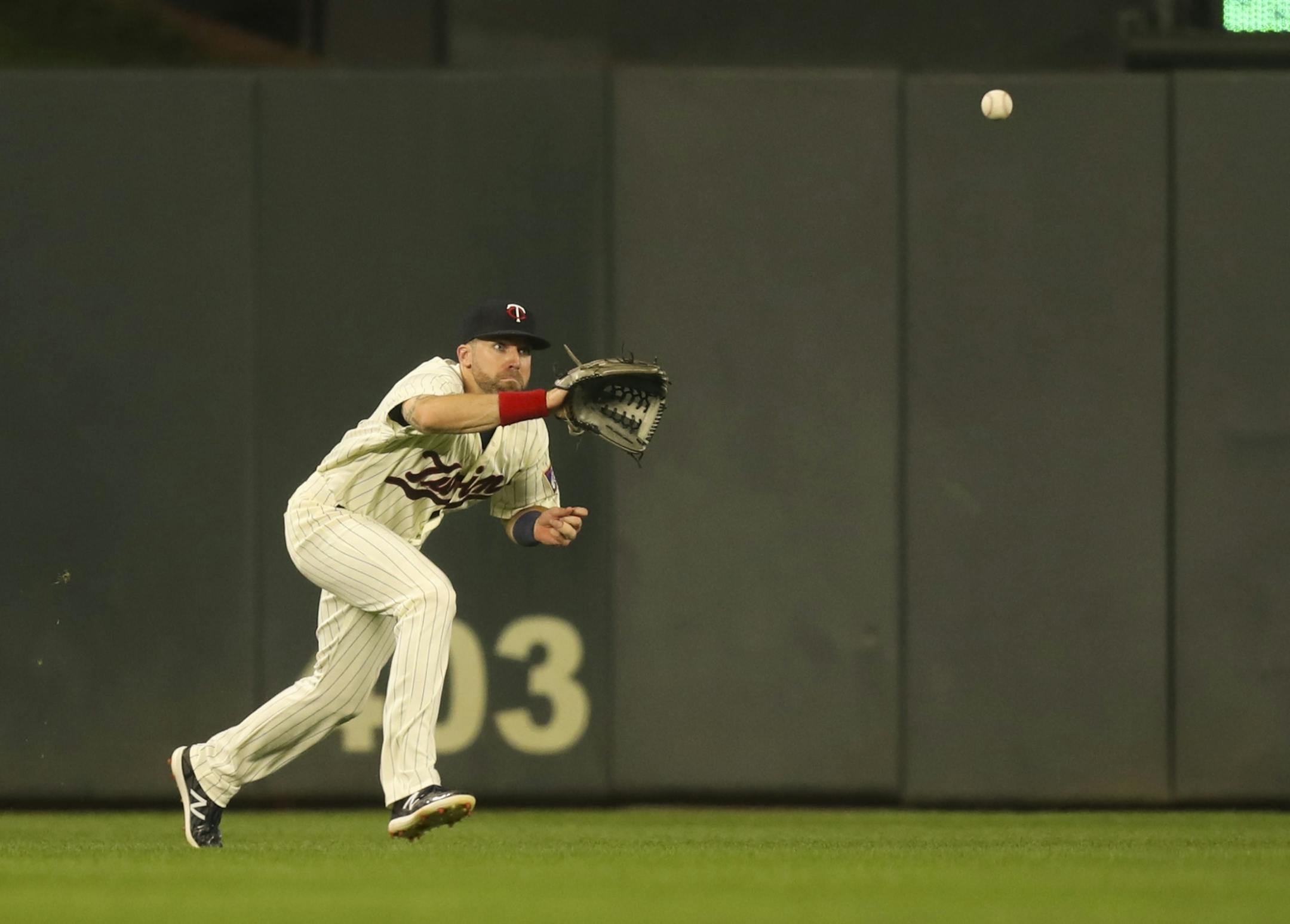 Minnesota Twins center fielder Jake Cave (60) field a line drive by New York Yankees third baseman Miguel Andujar in the fourth inning for the second out.