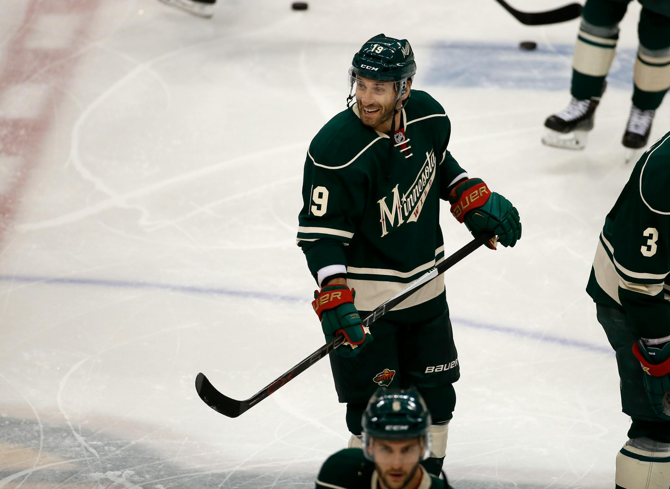 Minnesota Wild center Jarret Stoll (19) smiles at a former teammate before an NHL hockey game against the New York Rangers in St. Paul, Minn., Thursday, Dec. 17, 2015. (AP Photo/Ann Heisenfelt)