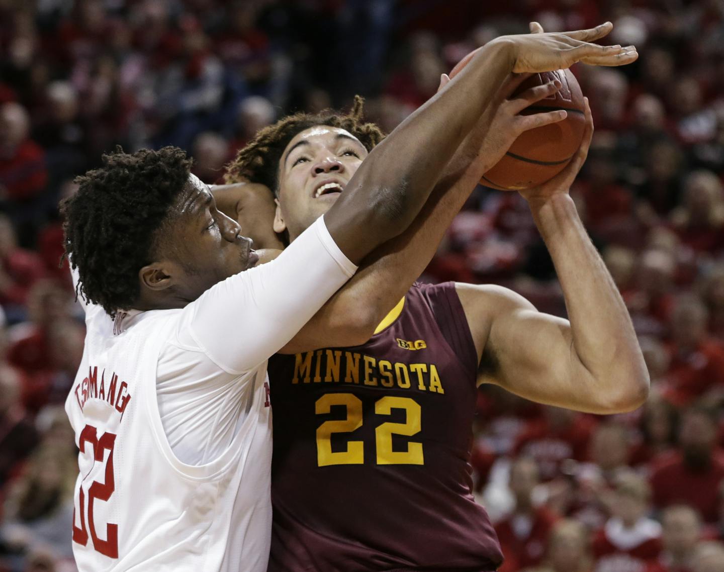 Minnesota's Reggie Lynch, right, is defended by Nebraska's Jordy Tshimanga during the first half of an NCAA college basketball game in Lincoln, Neb., Tuesday, Dec. 5, 2017. (AP Photo/Nati Harnik)