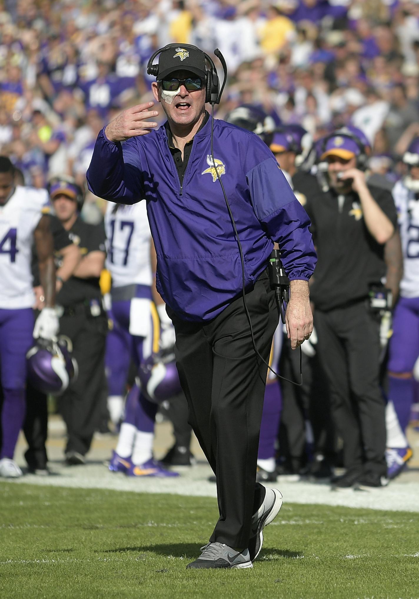 Minnesota Vikings head coach Mike Zimmer throws a challenge flag in front of head linesman Wayne&#x2020; Mackie (106) during the first half of an NFL football game against the Jacksonville Jaguars in Jacksonville, Fla., Sunday, Dec. 11, 2016. (AP Photo/Phelan M. Ebenhack)