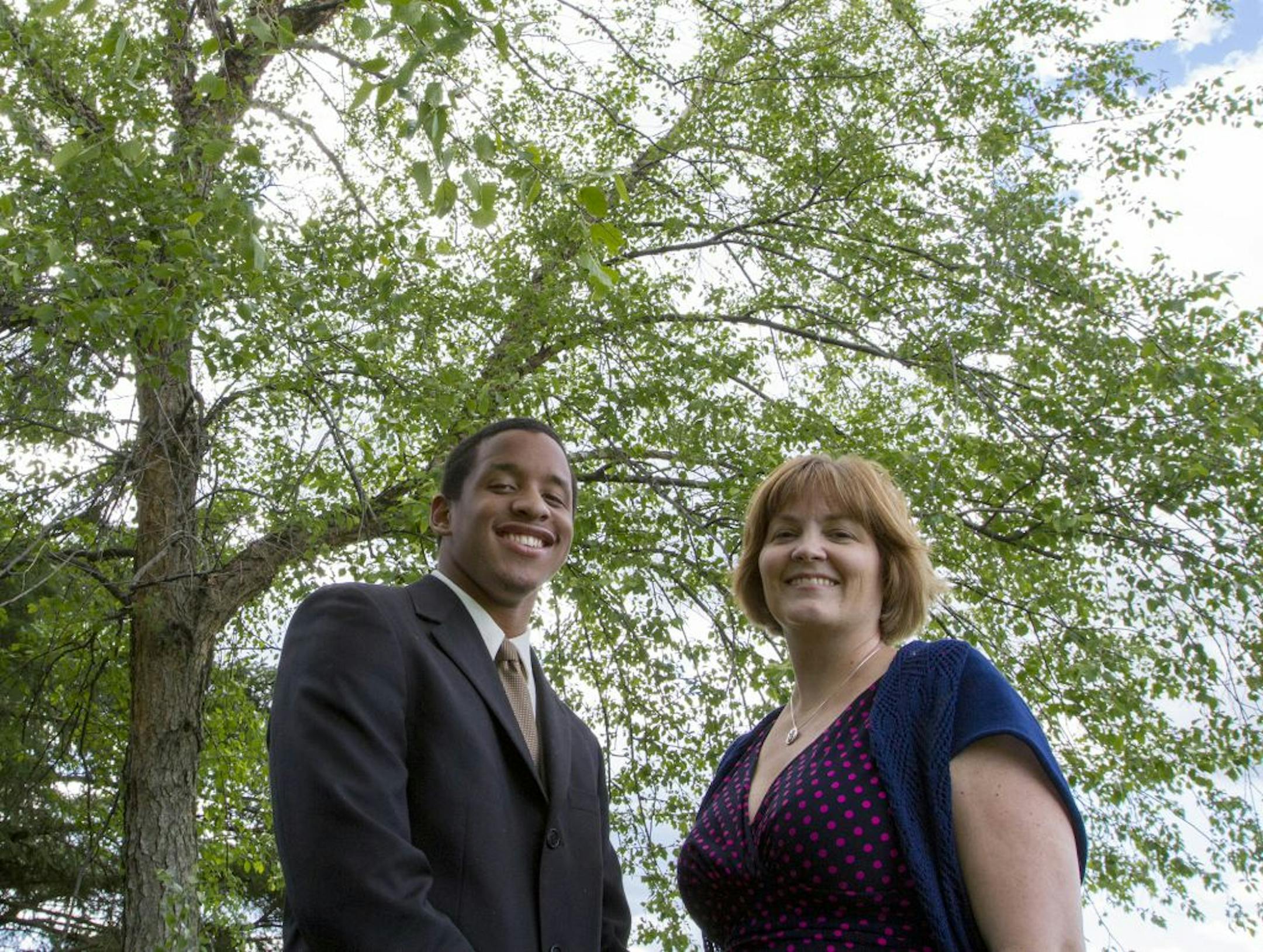 Kohlman Thompson (cq/source) posed for a portrait with his AVID instructor at Coon Rapids High School Debra Geiger (cq/source). Geiger described Thompson as the student to always say "I'll do it."
