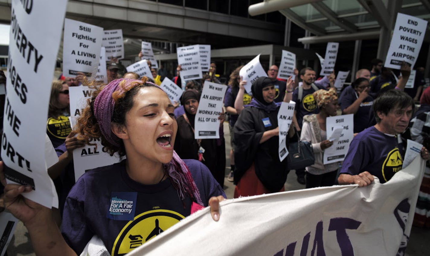 At the MSP airport on June 16, 2014, SEIU members and supporters demanded higher wages for the service workers that work there including Elsabet Binyam, far left .]richard.tsong-taatarii/rtsong-taatarii@startribune.com