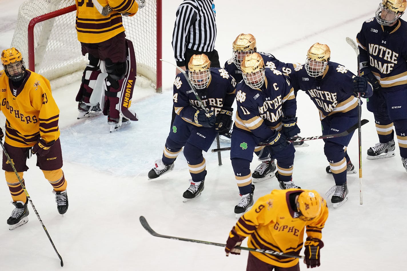 Notre Dame players celebrated after defenseman Spencer Stastney (24) scored a goal in the third period.