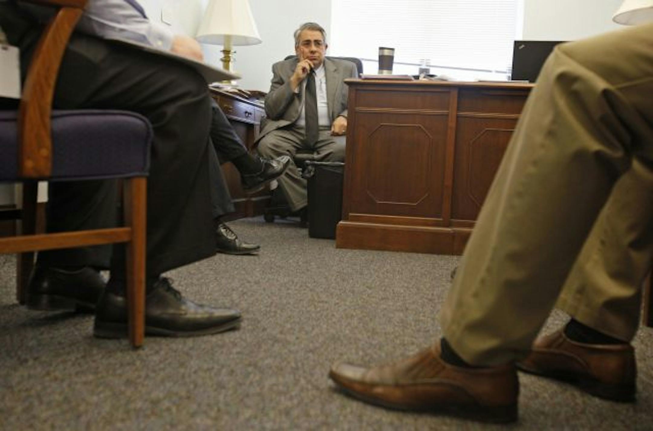 Rep. King Banaian met with advisers before heading to a committee meeting. The St. Cloud Republican is sponsoring a bill that would force state agencies to rebuild their budgets from zero.