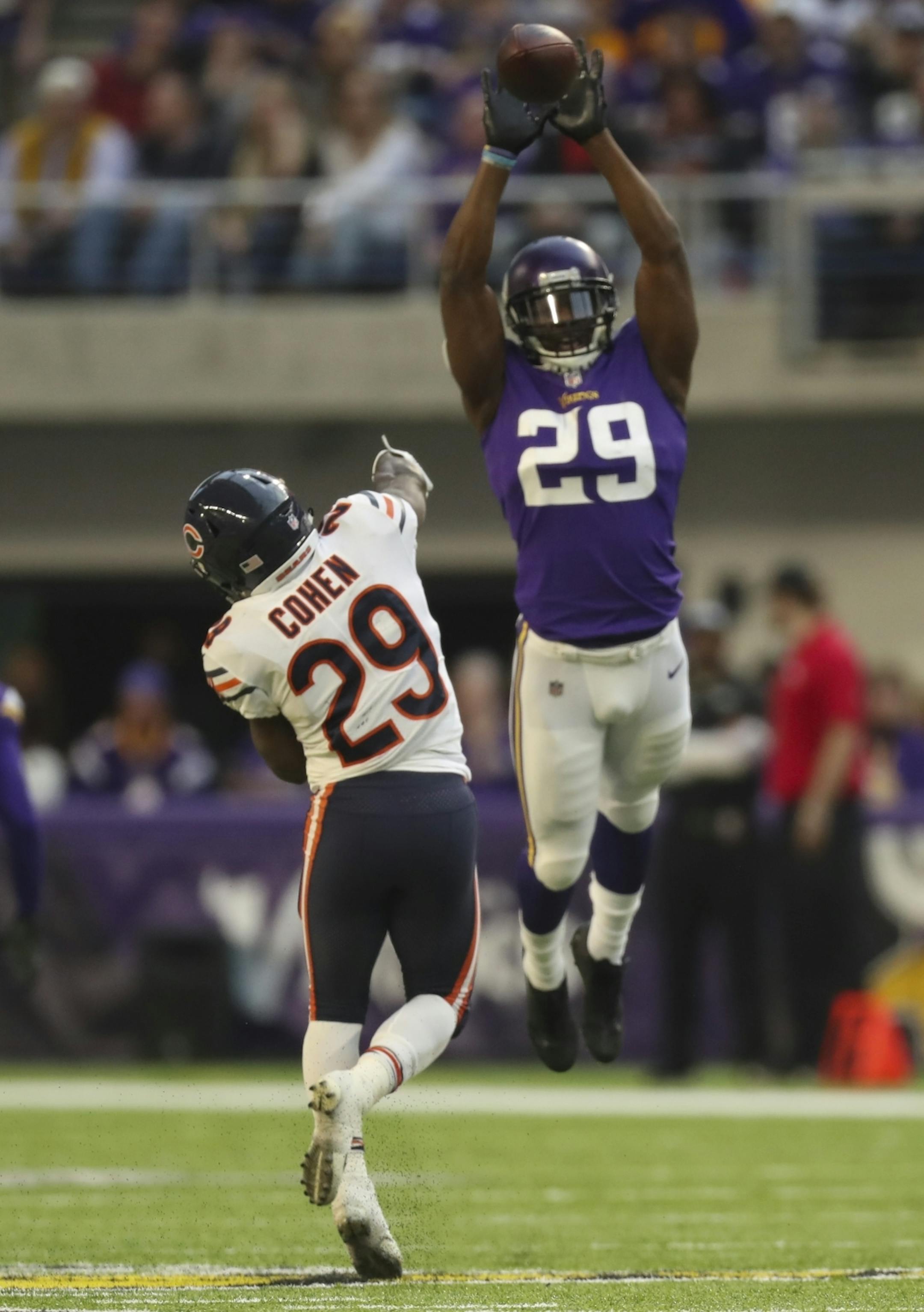 Minnesota Vikings cornerback Xavier Rhodes (29) leapt to try to block a pass by Chicago Bears running back Tarik Cohen (29) in the fourth quarter.