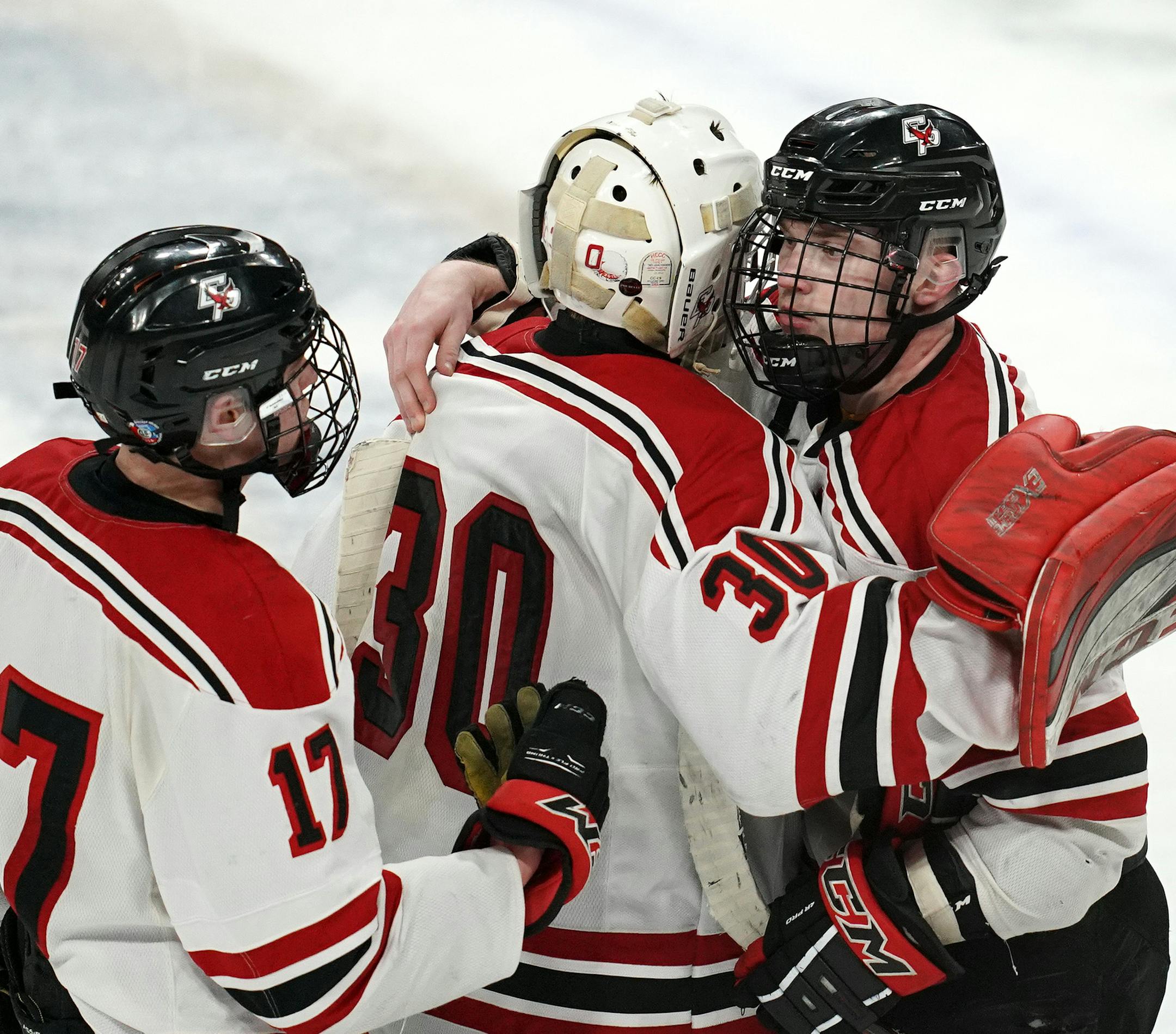 Eden Prairie forward Jack Jensen (18) celebrated with goaltender Axel Rosenlund (30) and forward Sam Wilhite (17) after scoring the game winning goal with less than a minute to play in triple overtime. ] ANTHONY SOUFFLE • anthony.souffle@startribune.com Lakeville South High School played Eden Prairie High School in a MSHSL Class 2A boys hockey quarterfinal game Thursday, March 7, 2019 at the Xcel Energy Center in St. Paul, Minn.