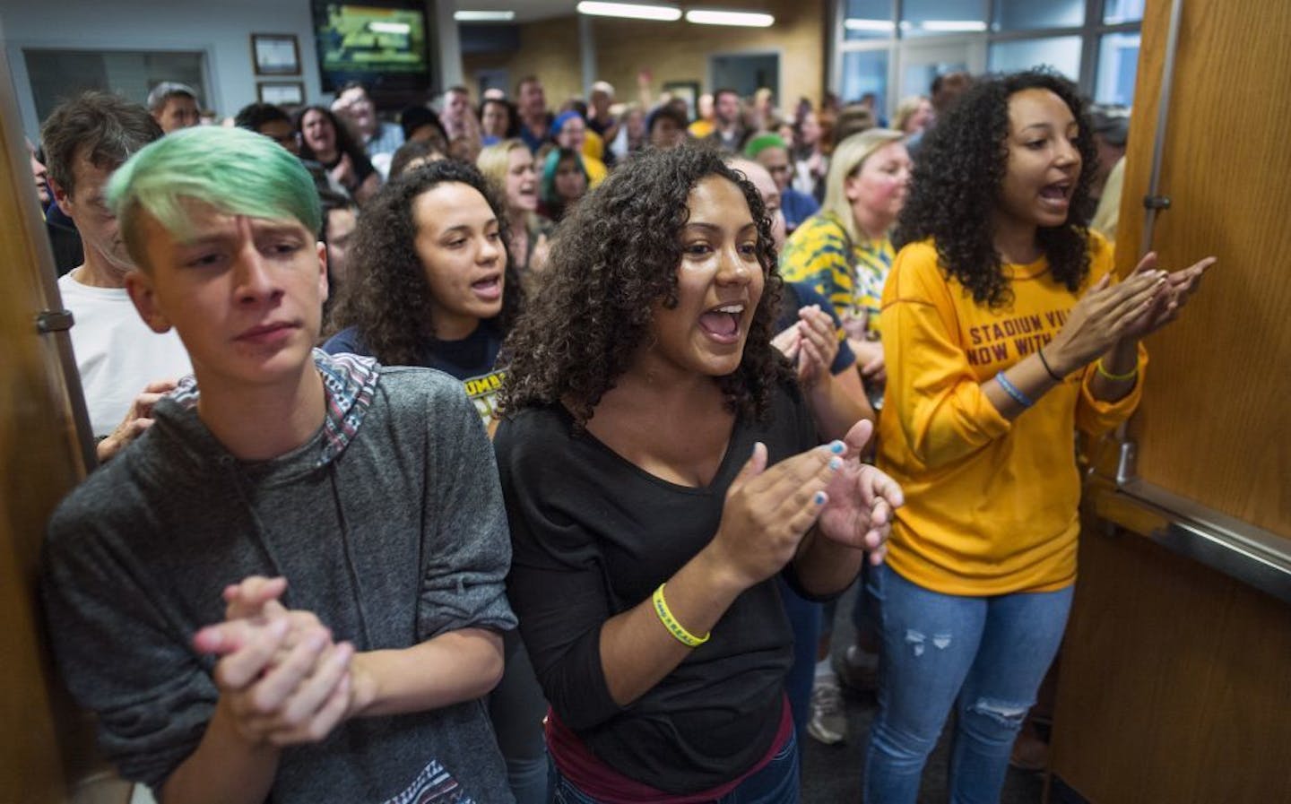 9/22/15 in Columbia Heights: Students far left, Hunter Bruschetta,16, Jada Bell, 17, and Emily Sheets,16 led were part of the overflow crowd who demanded Grant Nichols, the Columbia Heights school board member who allegedly made an anti-Muslim comment on Facebook, to resign.