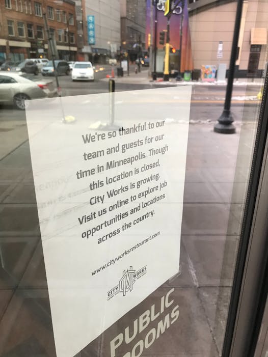 A sign posted on the door of City Works announces the closure.