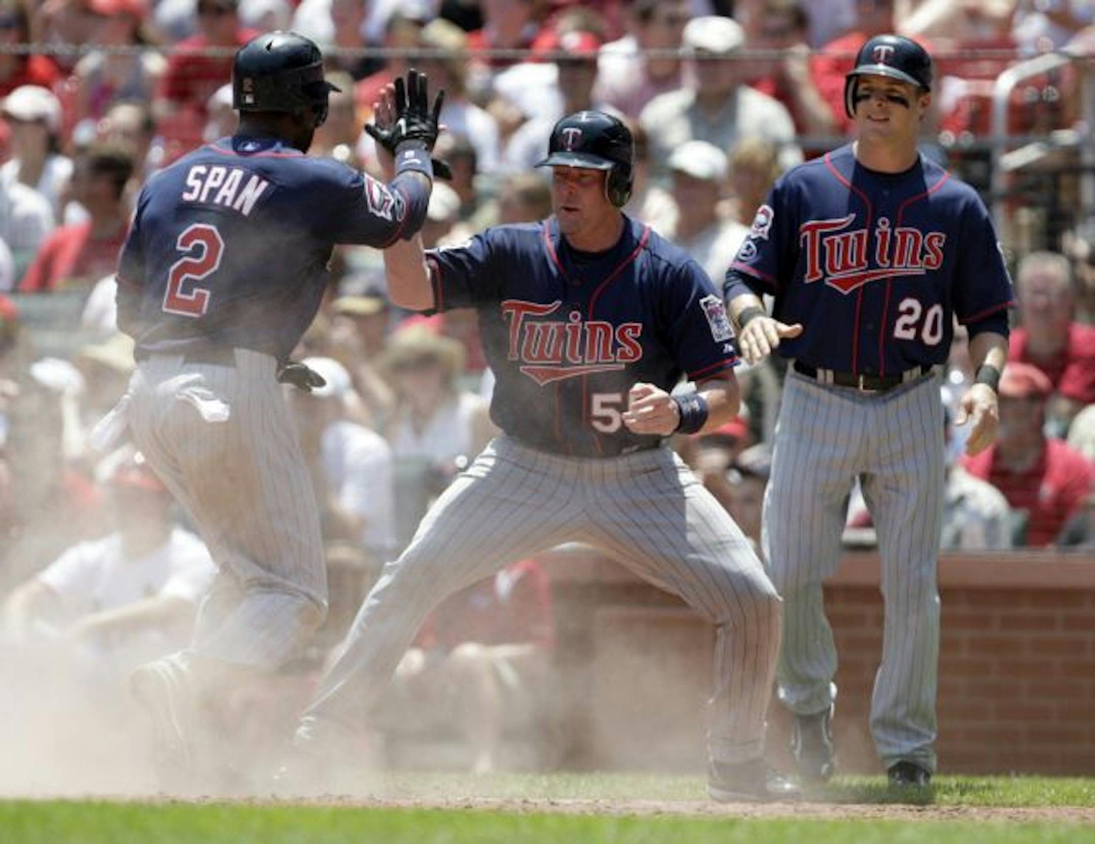 Mike Redmond (middle) with Denard Span and Matt Tolbert in 2009.