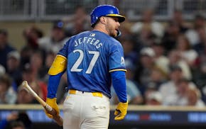 The Twins' Ryan Jeffers reacts after taking a called strike three on a full-count pitch in the eighth inning against Toronto on Friday night at Target