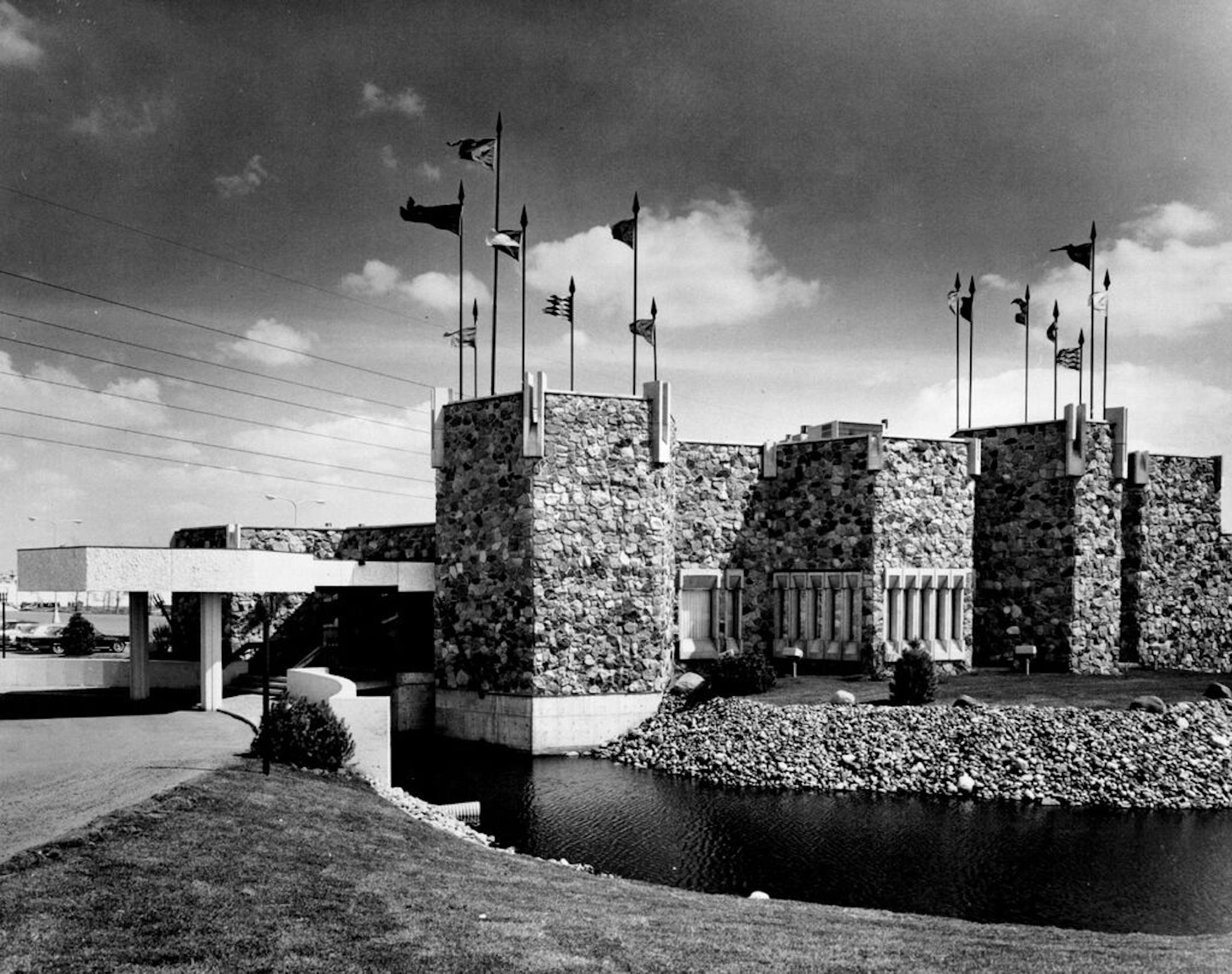Moat, banners, drawbridge and towers create a colorful, twentieth century version of King Arthur's headquarters for the Twin Cities' colorful Camelot restaurant.