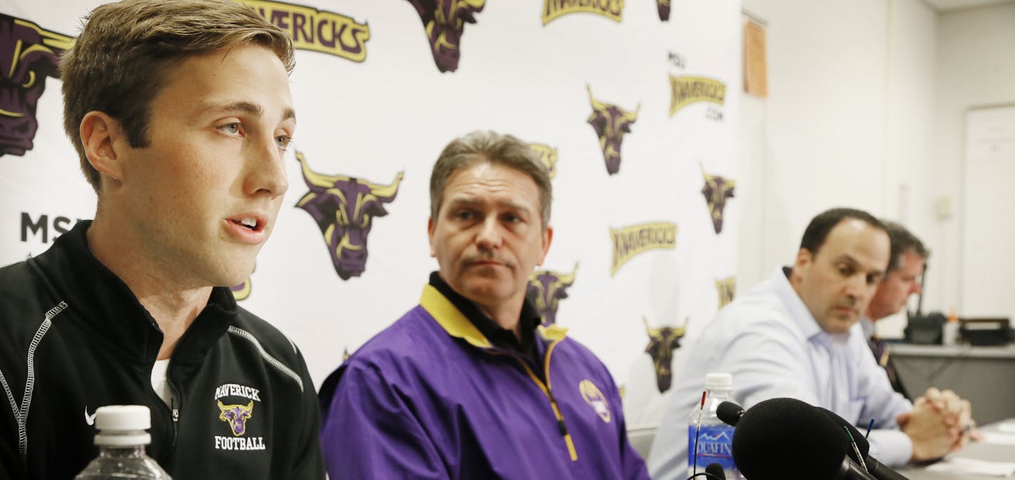 Minnesota State football player Sam Thompson left, read a statement during a news conference as Todd Hoffener coach, Aaron Keen associate coach, and Kevin Buisman athletics director looked on Thursday morning April 17, 2014 in Mankato , MN. conference. ] JERRY HOLT jerry.holt@startribune.com