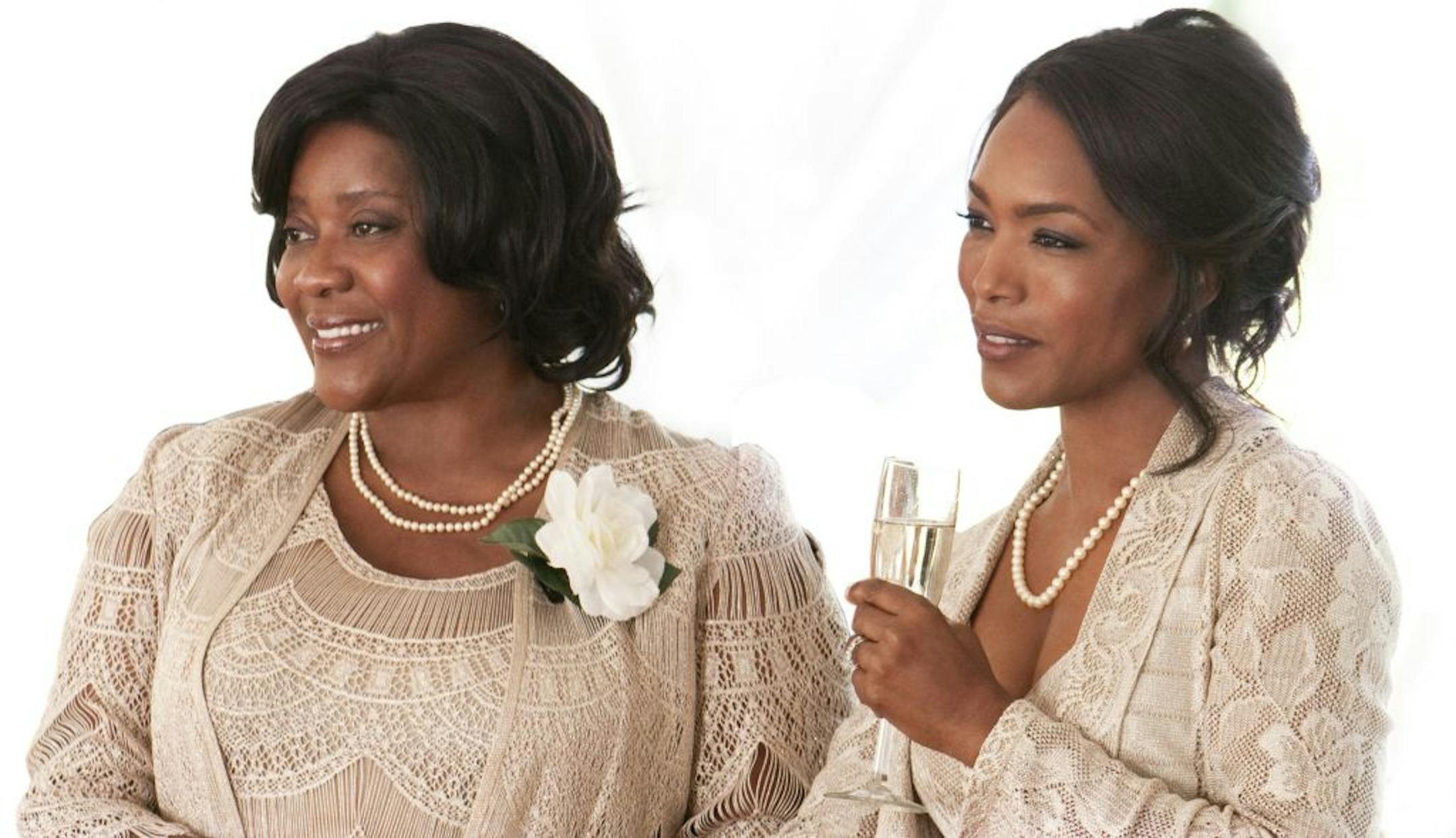 Mothers Loretta Devine and Angela Bassett have the same dress but different outlooks in "Jumping the Broom."