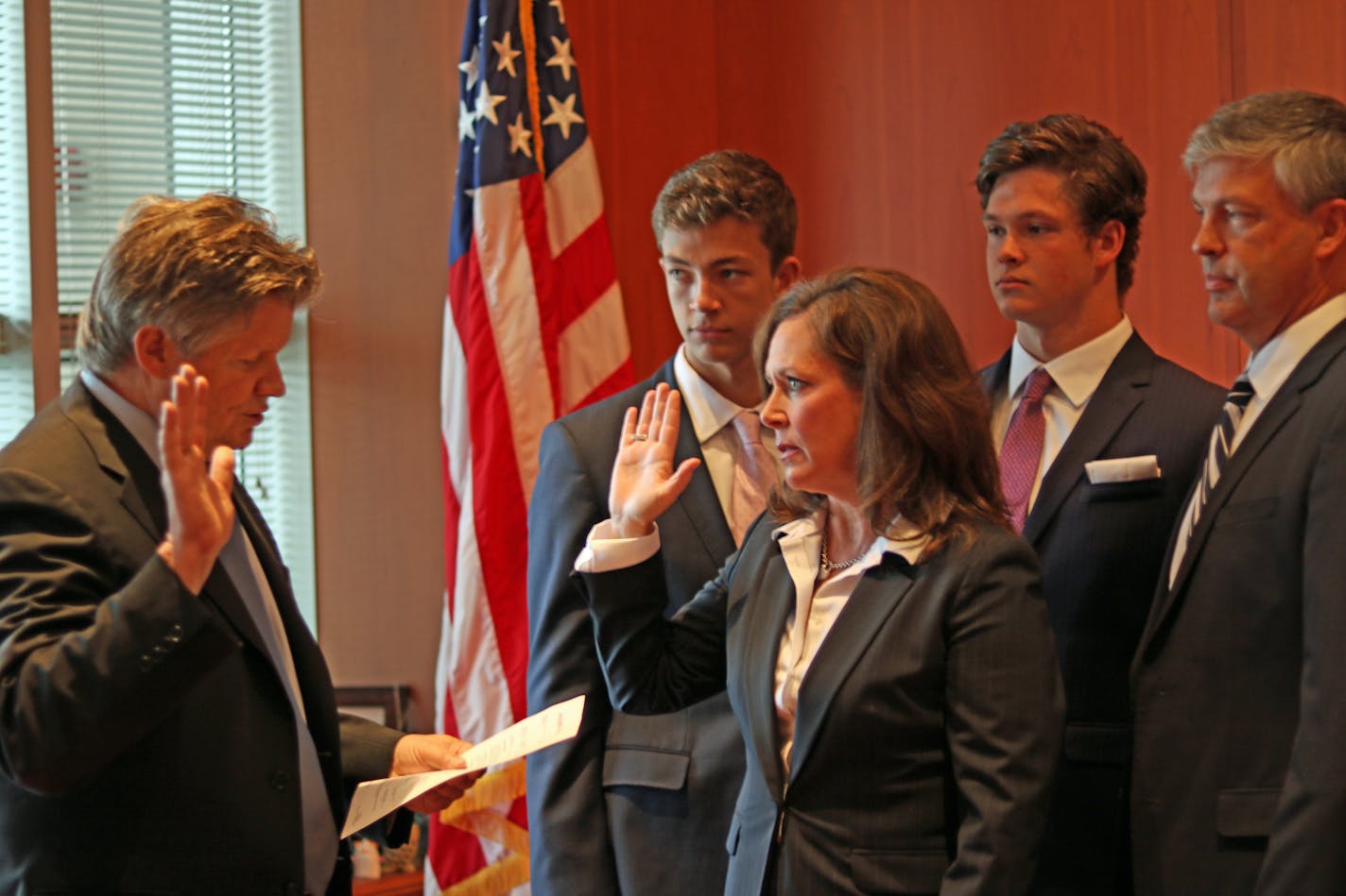 Erica H. MacDonald, the new U.S. attorney for Minnesota, takes the oath of office from U.S. District Court Chief Judge John R. Tunheim on June 11, 2018.