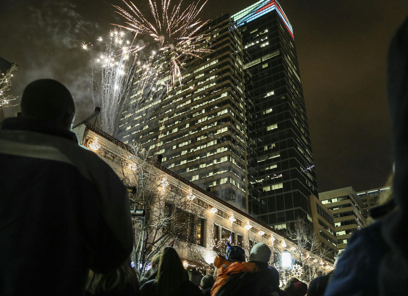 This is the first year of the reimagined Holidazzle, where it's Holidazzle Village, rather than the Holidazzle parade. Here, fireworks light the cold night sky over downtown Minneapolis, launched from Vincent's Friday, Nov. 28, 2014.](DAVID JOLES/STARTRIBUNE)djoles@startribune This is the first year of the reimagined Holidazzle, where it's Holidazzle Village, rather than the Holidazzle parade