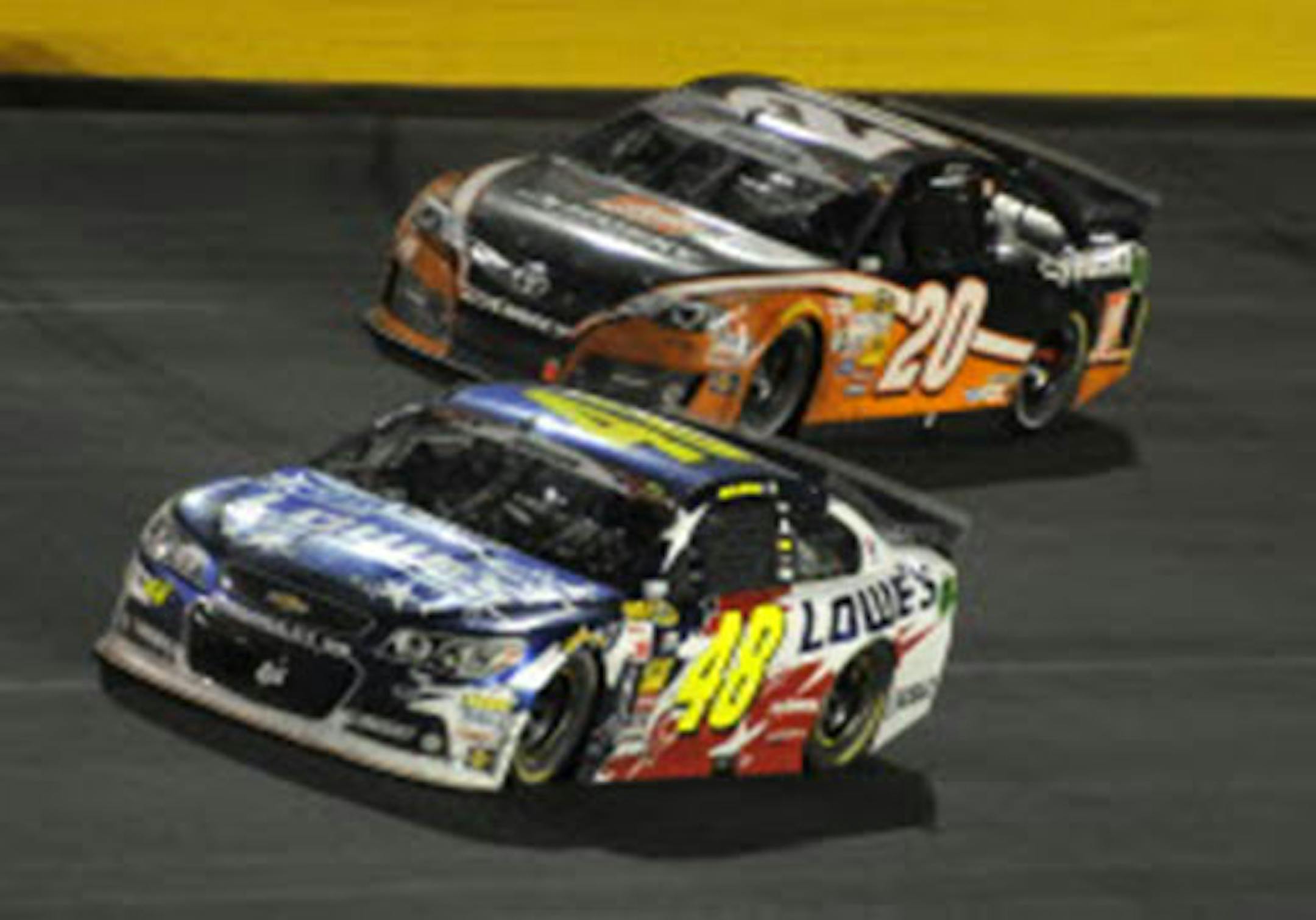 Jimmie Johnson passed Matt Kenseth for the lead in the closing laps of the NASCAR Sprint Cup series Coca-Cola 600 at Charlotte Motor Speedway in Concord, N.C., on Sunday.