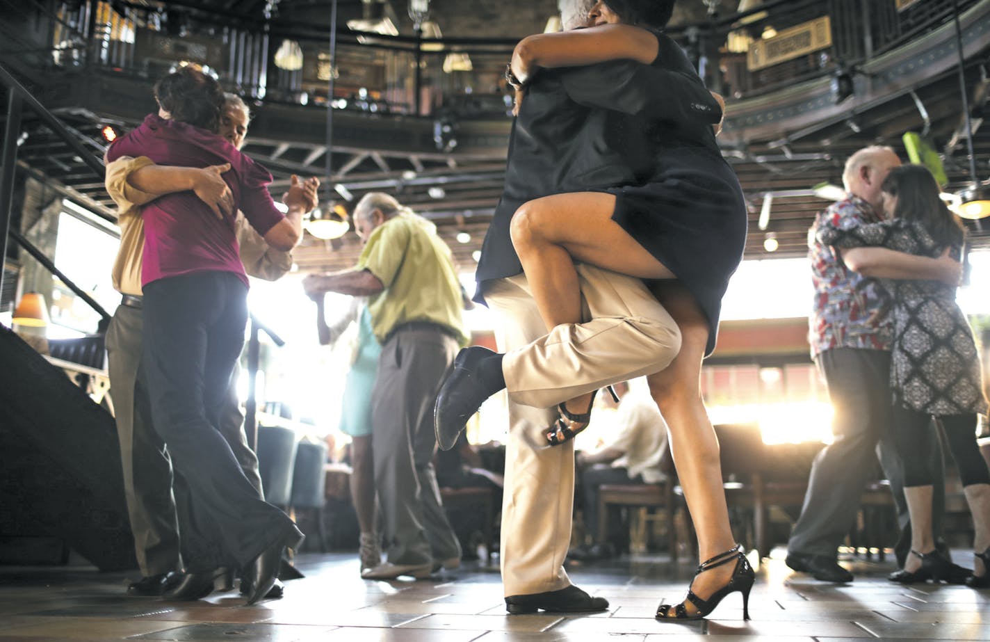 Naseema Omer and Len Mathe's legs intertwined while dancing the tango with each other Sunday evening at the Loring Pasta Bar. Mathe has Parkinson's and used to have to walk with the aid of a cane, swears by the therapeutic benefits of tango dancing. ] JEFF WHEELER &#xef; jeff.wheeler@startribune.com Dancing keeps us mentally sharp, researchers say, and dancing the tango is best of all because it demands an intense focus between partners. The Loring Pasta Bar in Dinkytown is host to an open dance