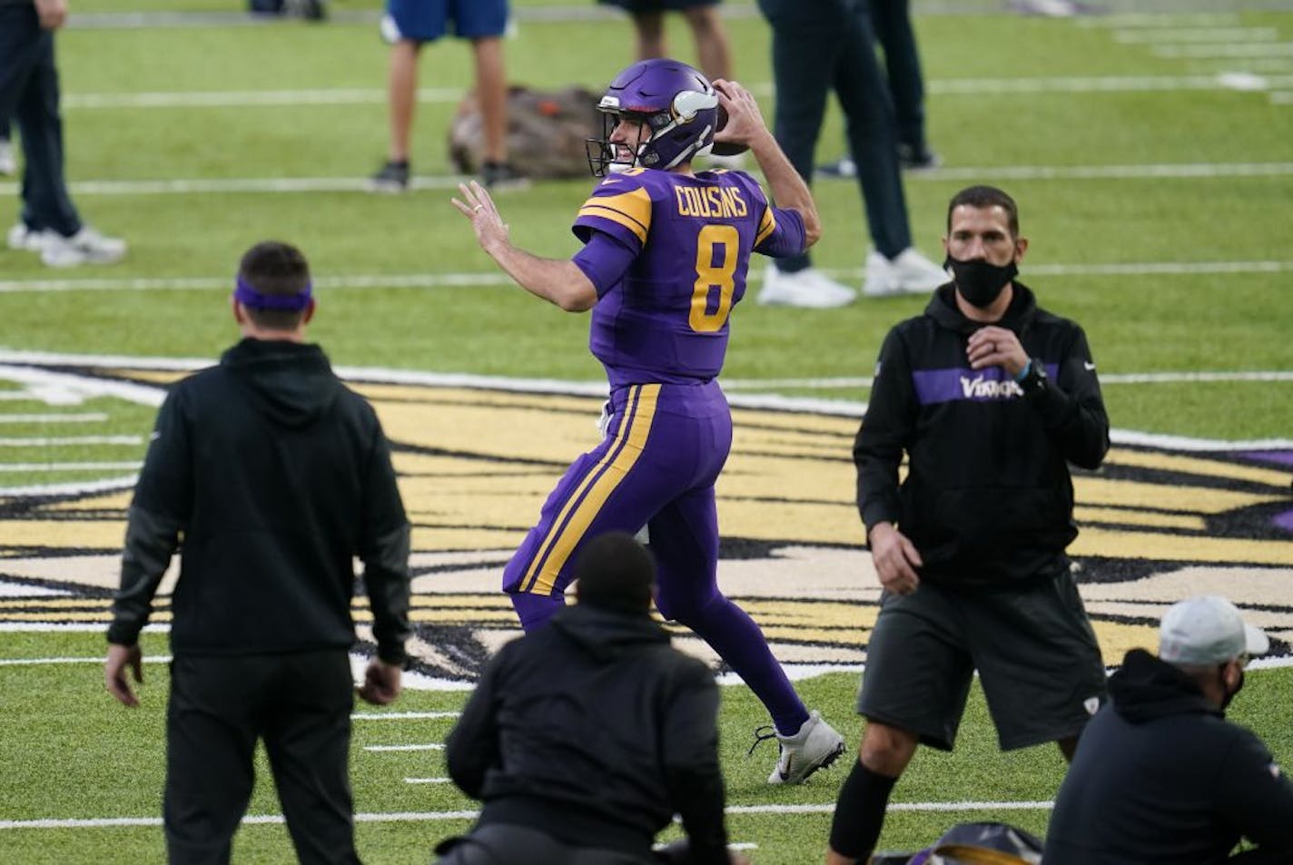 Minnesota Vikings quarterback Kirk Cousins (8) warms up before an NFL football game against the Dallas Cowboys, Sunday, Nov. 22, 2020, in Minneapolis.