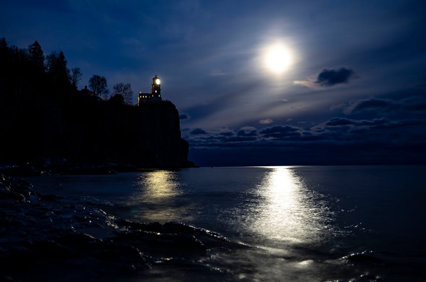 A bright moon shines over Lake Superior near Split Rock Lighthouse in Lake County, north of Two Harbors, Minn.