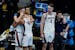 Gonzaga forward Corey Kispert (24) hugs Jalen Suggs (1) as Gonzaga forward Drew Timme (2) looks on at the end of the championship game against Baylor 