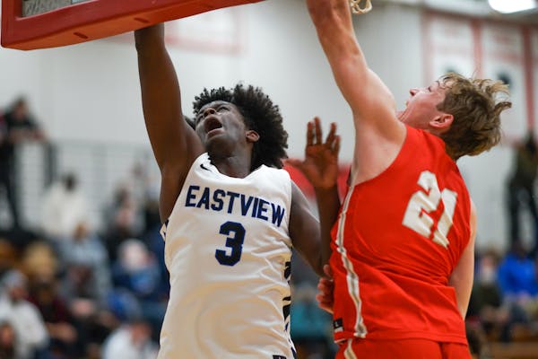 Eastview’s Kayser Hassan, a JV player a year ago who has become a double-digit scorer for the Lightning, went up for an easy basket in a game agains