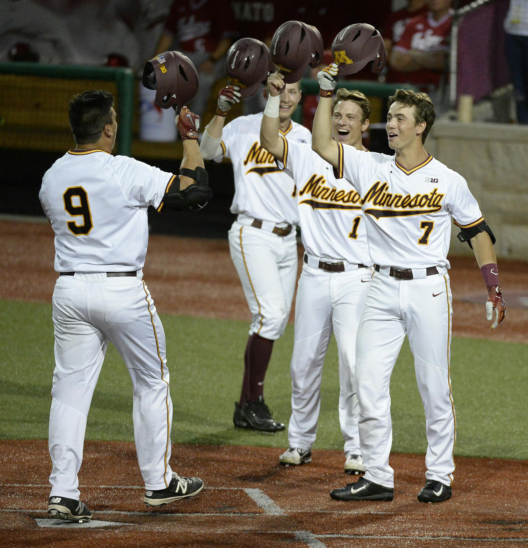 Chris Howell | Herald-Times
Minnesota outfielder Eddie Estrada (9) celebrates his three run home run that gave the Gophers a one run lead in the bottom of the eighth during the Indiana Minnesota Big Ten Baseball Tournament at Bart Kaufman Field in Bloomington, Ind. Friday, May 26, 2017. ORG XMIT: inbht101