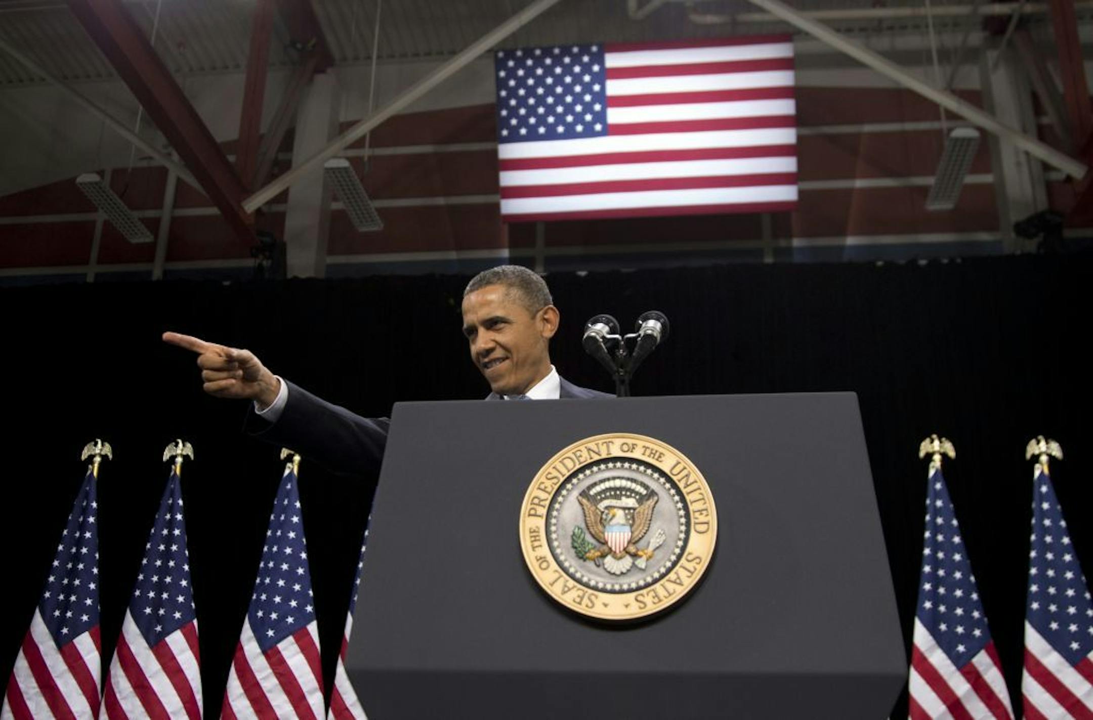 President Barack Obama points to someone in the crowd as he arrives to speak about immigration at Del Sol High School, Tuesday, Jan. 29, 2013, in Las Vegas.