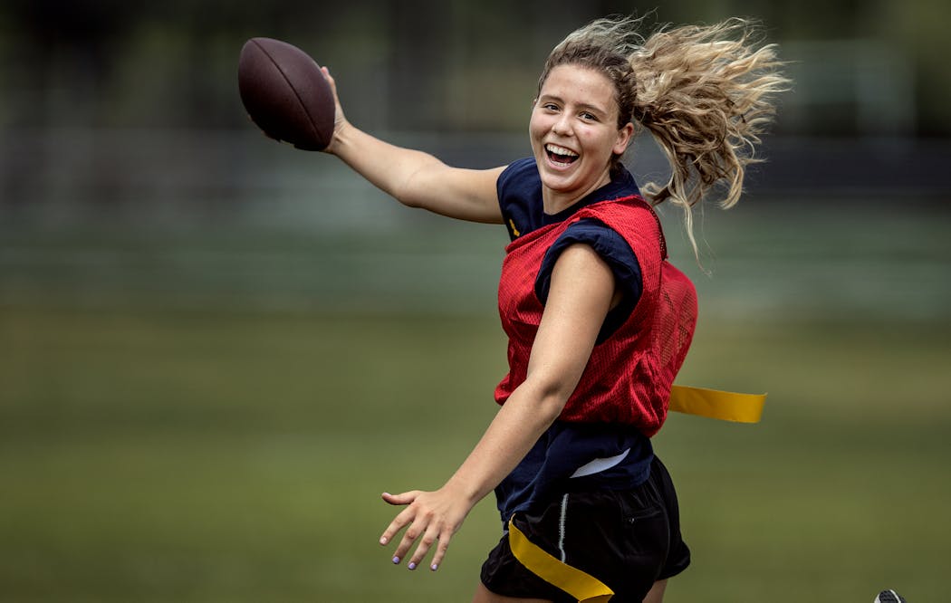 Tayah Leenderts, who celebrated a touchdown catch in the Go Girl Flag Football League, also plays on Rosemount’s skilled girls’ basketball team.