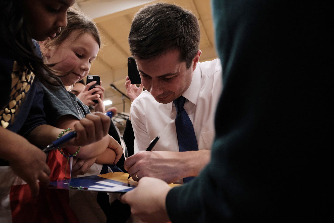 Pete Buttigieg, the former mayor of South Bend, Ind., a Democratic candidate for president, signs autographs during a town hall campaign event at Sparks High School in Sparks, Nev. on Sunday, Feb. 16, 2020. (Mason Trinca/The New York Times)