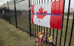 A tribute is displayed Monday, April 20, 2020, at the Royal Canadian Mounted Police headquarters in Dartmouth, Nova Scotia, following a weekend shooti