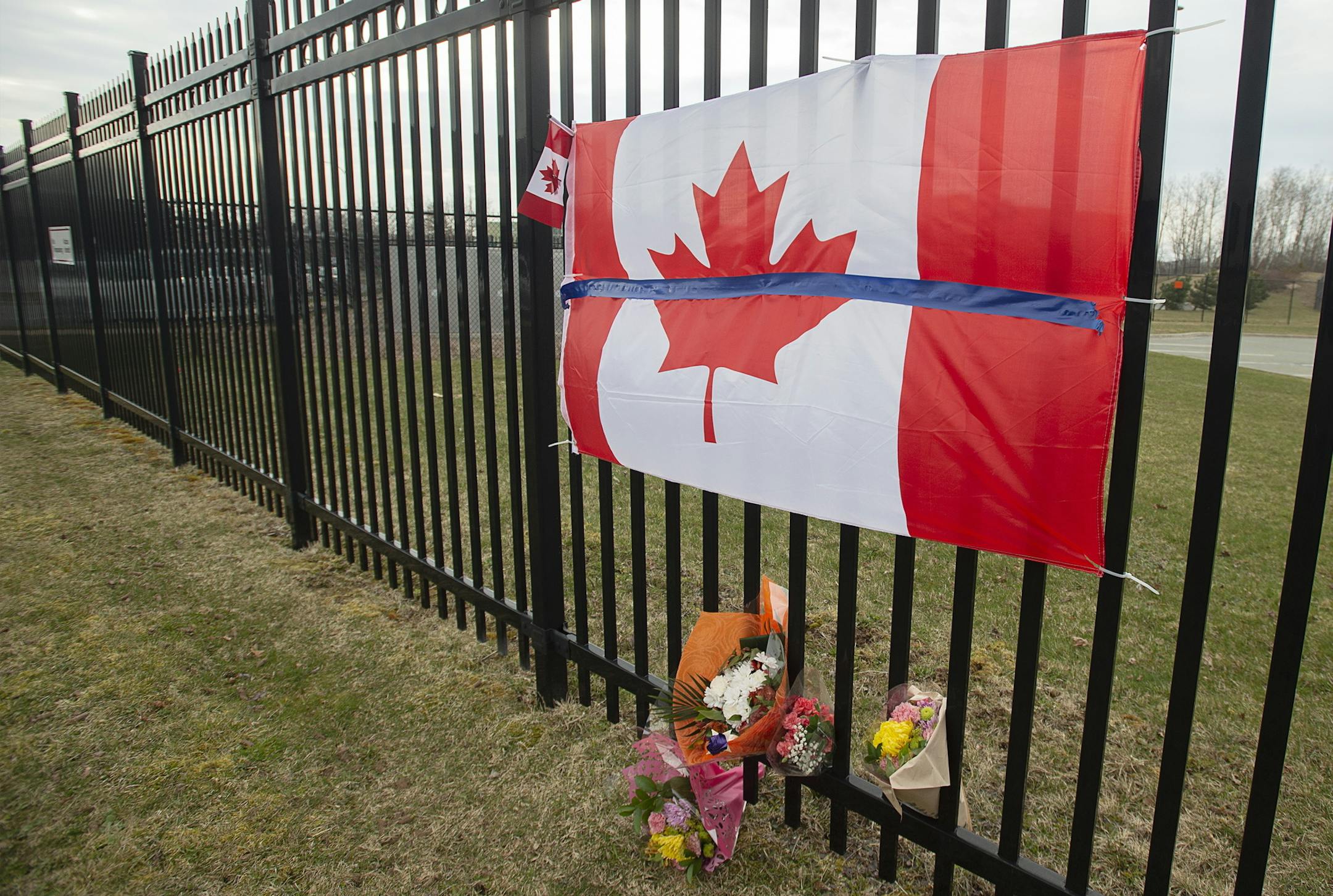 A tribute is displayed Monday, April 20, 2020, at the Royal Canadian Mounted Police headquarters in Dartmouth, Nova Scotia, following a weekend shooting rampage by a gunman, disguised as a police officer, that killed multiple people including an RCMP constable. (Andrew Vaughan/The Canadian Press via AP)
