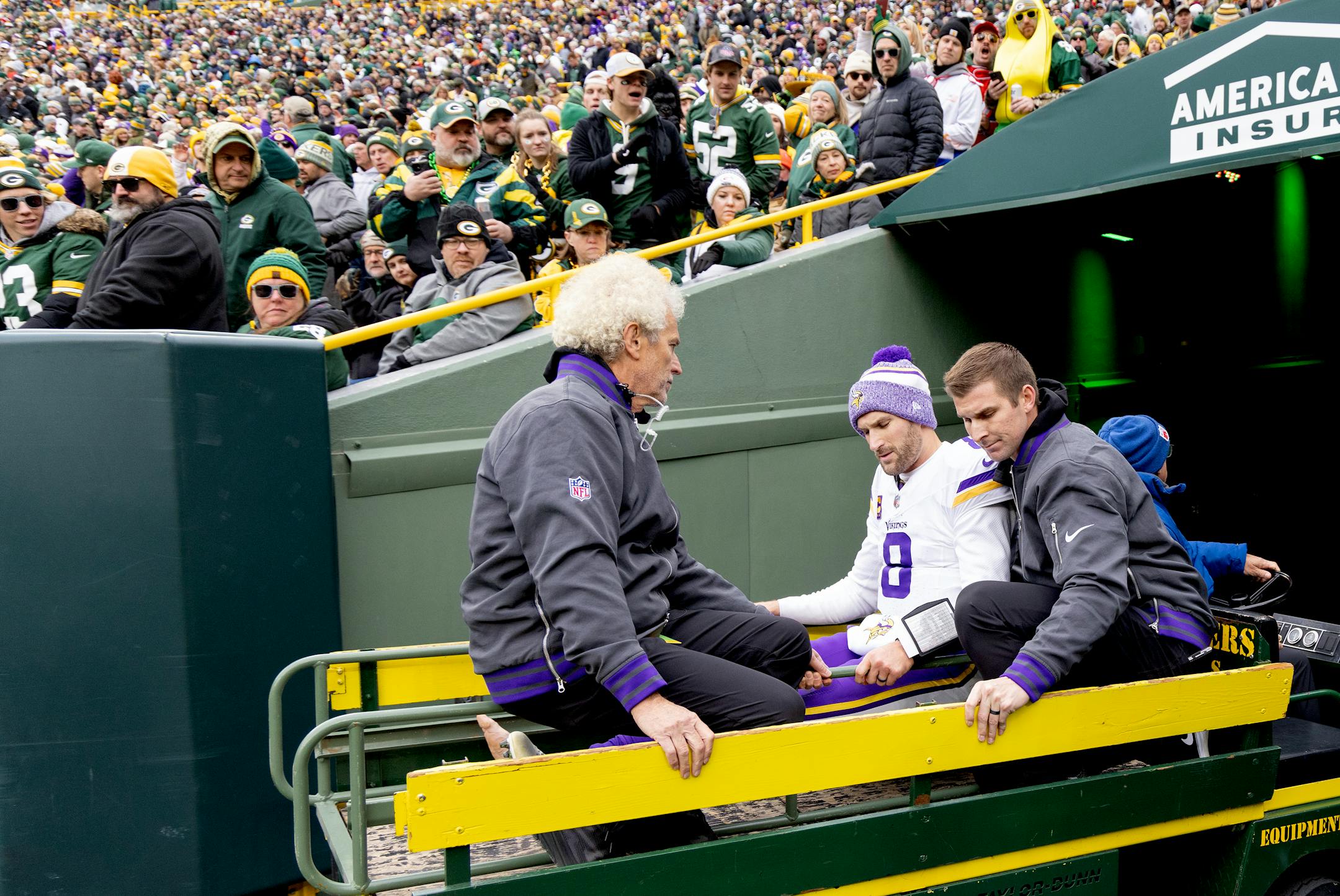 Minnesota Vikings quarterback Kirk Cousins (8) is carted off the field after sustaining an injury during the second half of an NFL football game against the Green Bay Packers, Sunday, Oct. 29, 2023, in Green Bay, Wis. (Carlos Gonzalez/Star Tribune via AP)