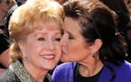 Debbie Reynolds, left, and Carrie Fisher at the Primetime Creative Arts Emmy Awards in Los Angeles on Sept. 10, 2011.