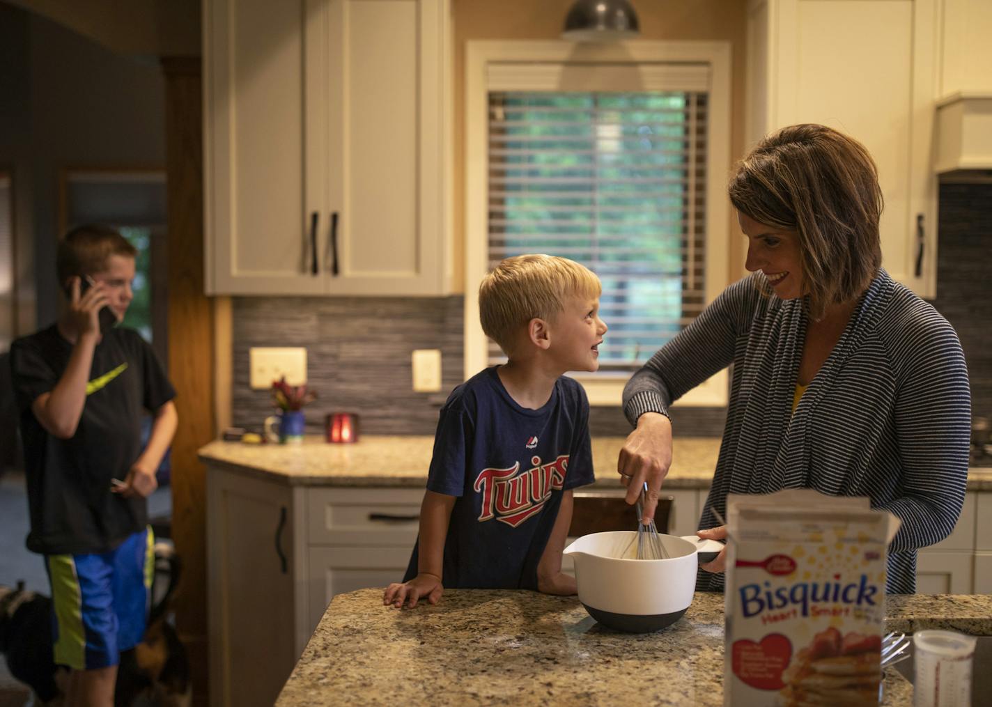 Ian Anderson helped mix the pancake batter with his mom, Mali, while they made breakfast for dinner.