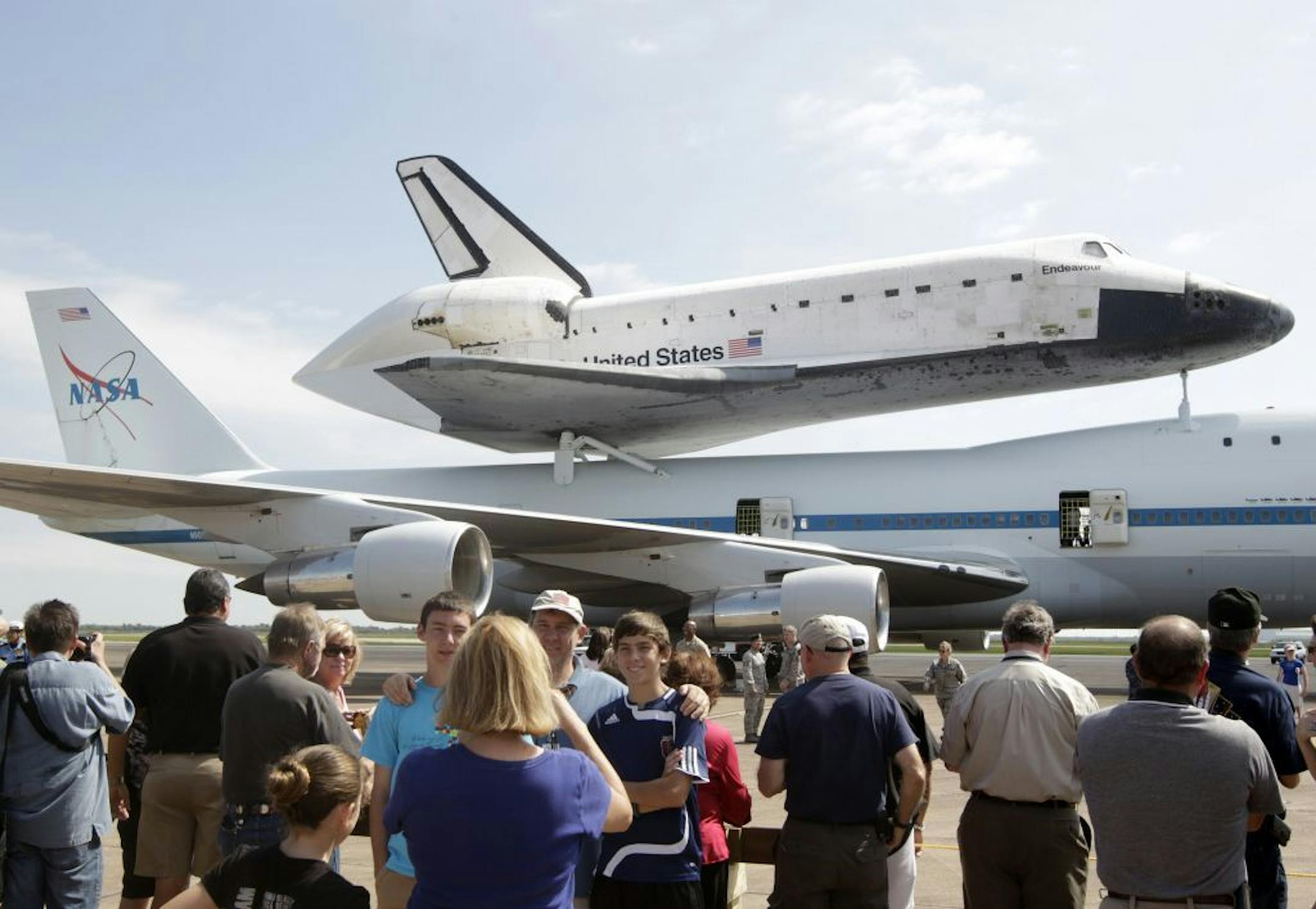 A large crowd takes photographs of the Space Shuttle Endeavour sitting atop NASA's 747 Shuttle Carrier Aircraft at Ellington Field in Houston on Wednesday, Sept. 19, 2012.