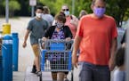 Shoppers entered the Walmart in Apple Valley on Friday. Minnesota health officials are urging people to wear masks to slow the spread of COVID-19.