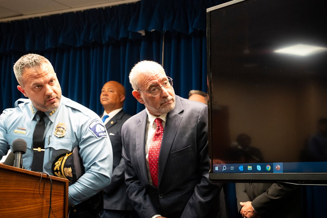 Minneapolis Police Chief Brian O’Hara, left, and Minnesota U.S. Attorney Andrew Luger announced charges Aug. 16 against 14 Minneapolis gang members, alleging possession of machine guns, fentanyl trafficking and firearms violations.