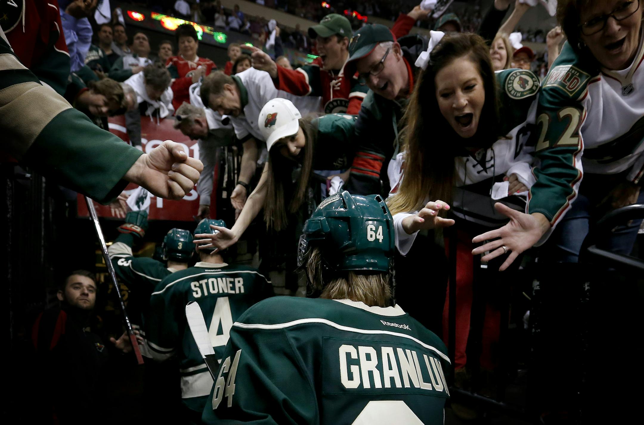 Mikael Granlund (64) was greeted by cheering fans as he walked into the locker room after scoring the game winning goal in overtime. ] CARLOS GONZALEZ cgonzalez@startribune.com - April 21, 2014, St. Paul, Minn., Xcel Energy Center, NHL, Minnesota Wild vs. Colorado Avalanche, Stanley Cup Playoffs round 1, Game 3
