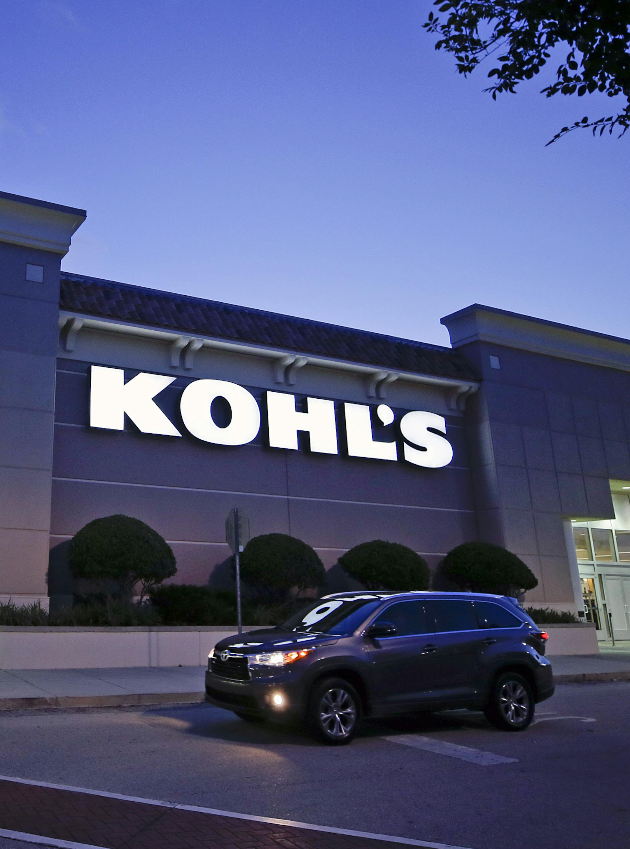 FILE- In this Aug. 22, 2017, file photo, a car drives by the entrance of a Kohl's department store in Orlando, Fla. Kohl's Corp. reports earnings on Tuesday, May 22, 2018. (AP Photo/John Raoux, File)