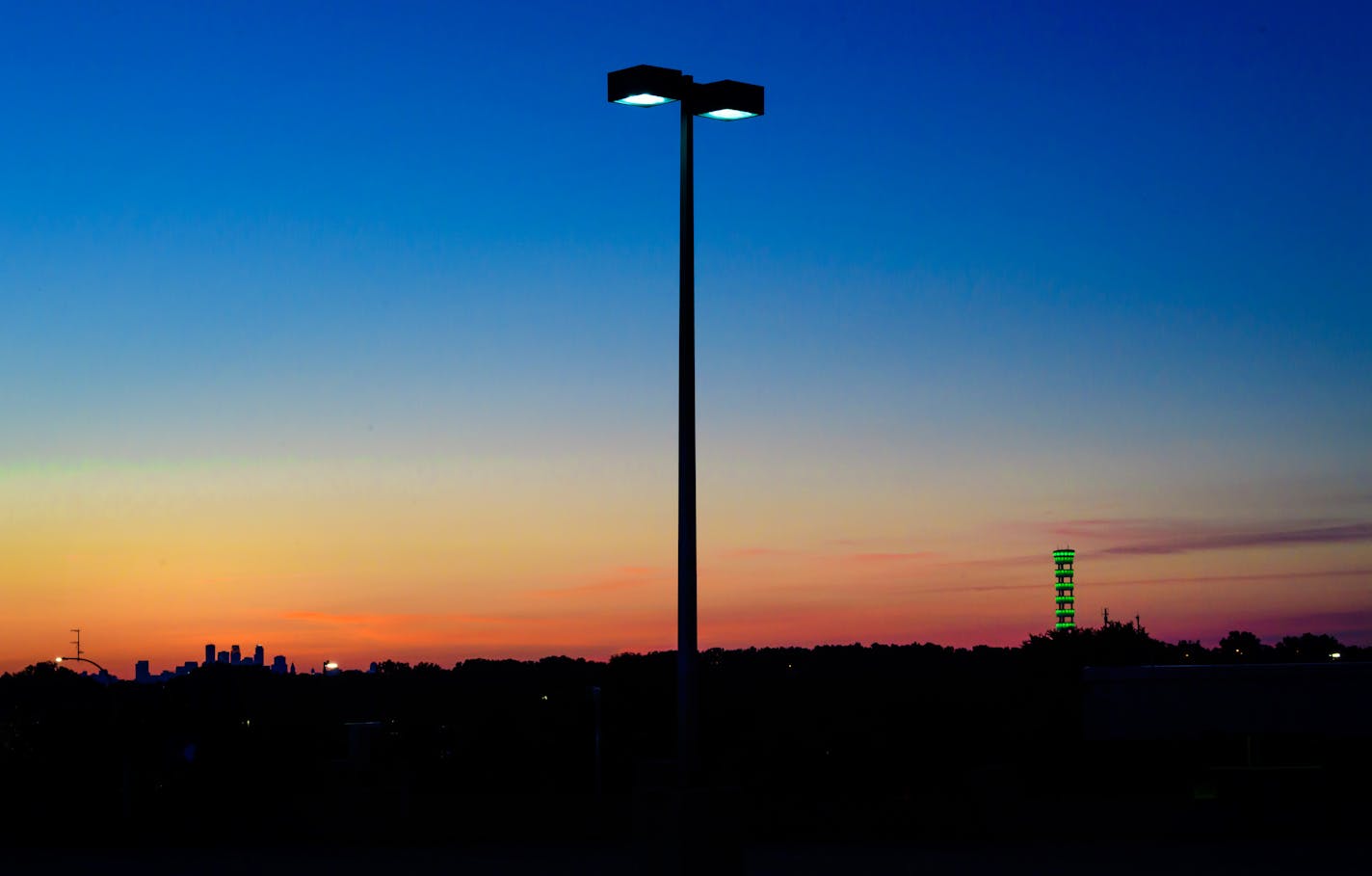 A new wave of small cell wireless technology is being attached to streetlights and flagpoles in areas where there's a high demand for data. A larger telecommunications tower in Eagan is in the distance.