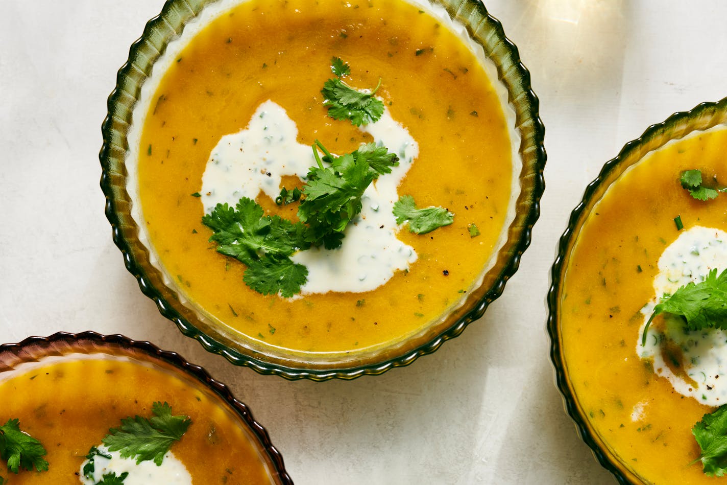 Spicy carrot-ginger soup. You may think of squash as the ideal fall soup, but this carrot one may change your mind. Food styled by Simon Andrews. (David Malosh/The New York Times)