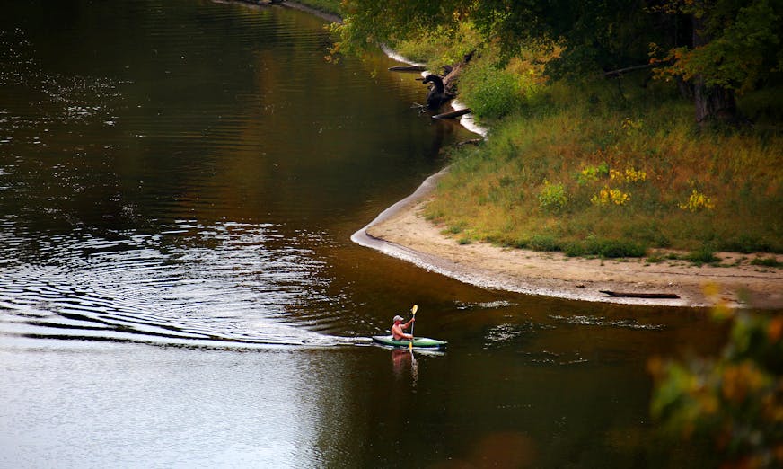 BRIAN PETERSON ¥ brianp@startribune.com St. Paul, MN 9/24/2009 ] A lone kayaker makes his way from the Minnesota River into the Mississippi near Pike Island near Fort Snelling Thursday afternoon. Minnesota and 11 other states in the watershed of the Mississippi River will get $320 million from the federal government to clean up the river. U.S. Agriculture Secretary Tom Vilsack announced the program today, calling the 2,350-mile river "a critical national resource." The Mississippi River Basin Healthy Watersheds Initiative is designed to improve water quality during the next four years in an attempt to shrink the "dead zone" the river's pollutants create in the Gulf of Mexico.