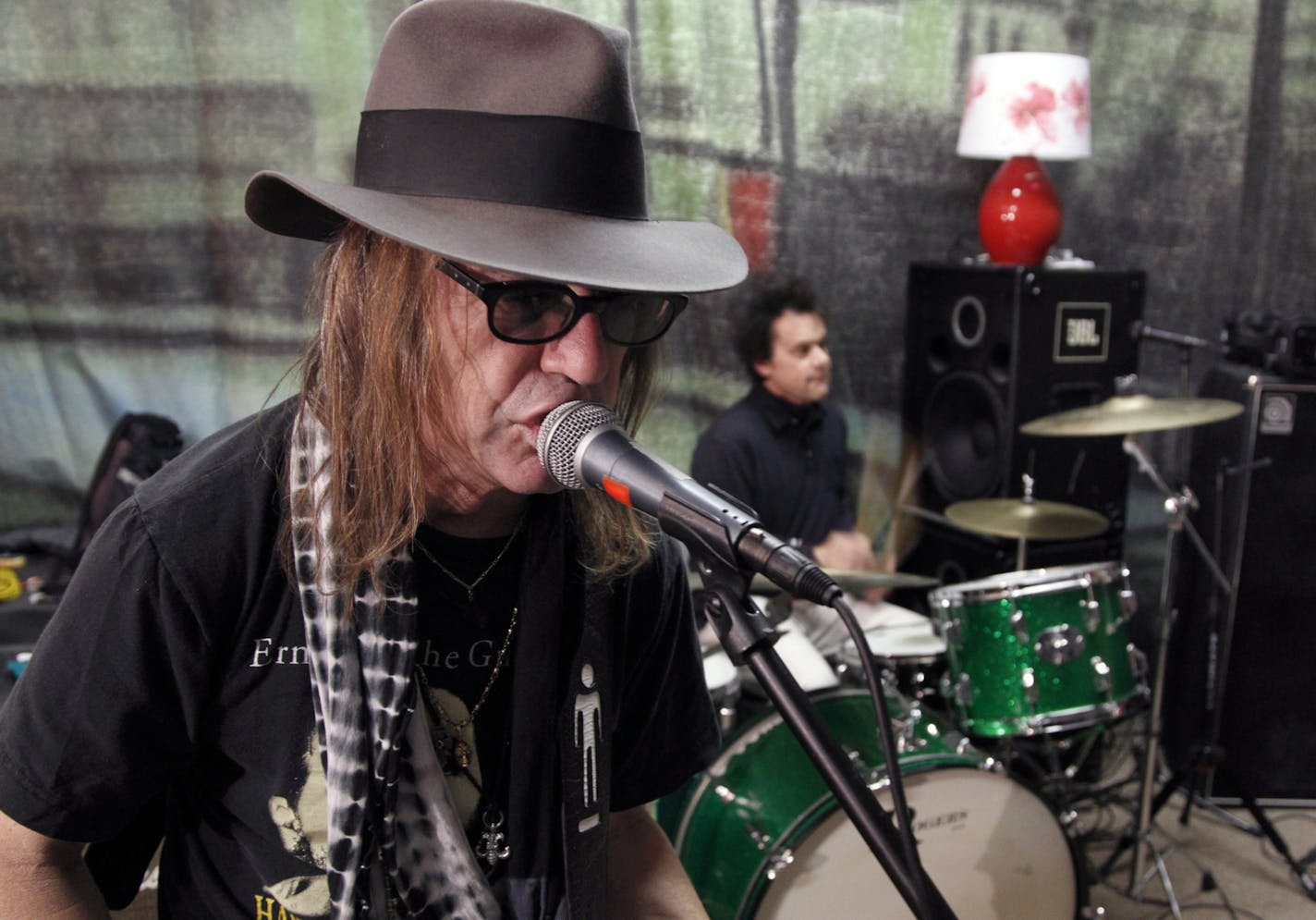 The Suburbs, John "Beej" Chaney, guitar vocals, during a rehearsal last week in North Minneapolis. He and the band were getting ready for another round of Suburbs reunions, and he's back in the studio recordings for the first time in years. [ TOM WALLACE • twallace@startribune.com_ Assignment_#20020565A_ November 11, 2011 _ SLUG: burbs1118_ EXTRA INFORMATION: Name CQ, Internet, John "Beej" Chaney, guitar vocals, keyboardist Chan Poling, Hugo Klaers, drums, bassist Michael Halliday, Steve Brantse