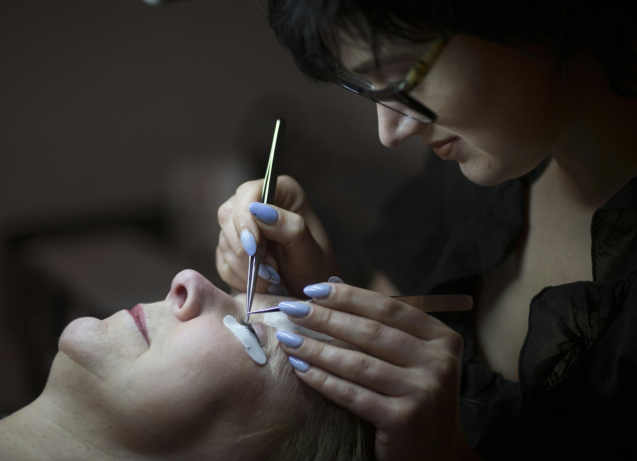 Kae Kozlowski owner of BROW CHIC brow & lash boutique applied eyelash extension to Jan McDaniels Wednesday April 20, 2016 Minneapolis, MN.] Jerry Holt /Jerry.Holt@Startribune.com