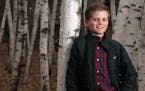 Essay contest winner Ben Meisterling, 11, in the woods behind his home in Mendota Heights. He spread jokes throughout his neighborhood.