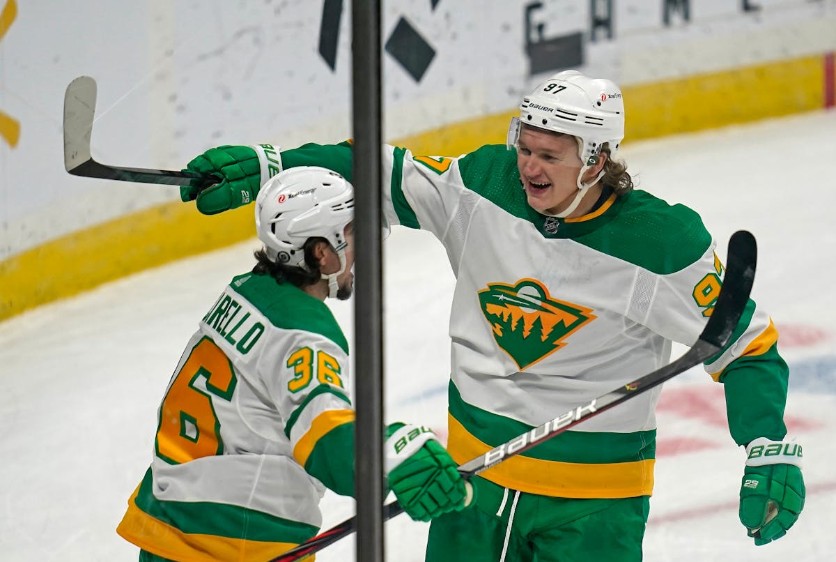 Minnesota Wild left wing Kirill Kaprizov (97) celebrated his third goal with Minnesota Wild right wing Mats Zuccarello (36) during the third period. K