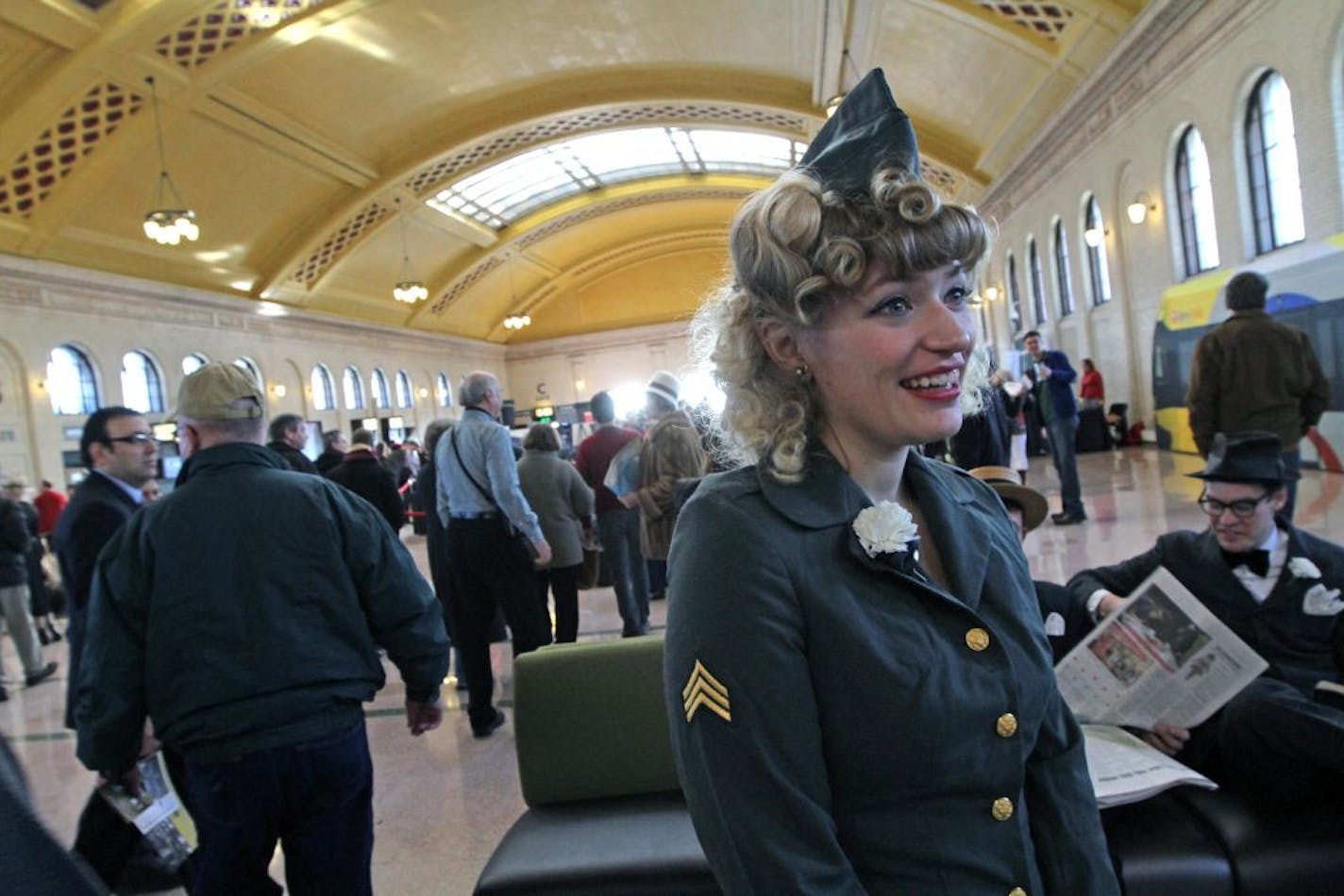 (left to right) Amelia English and Billy Mullaney, 1940's reenactors from the Bedlam Theatre in St. Paul, greeted some of the thousands of people who attended the Union Depot grand reopening on 12/8/12.