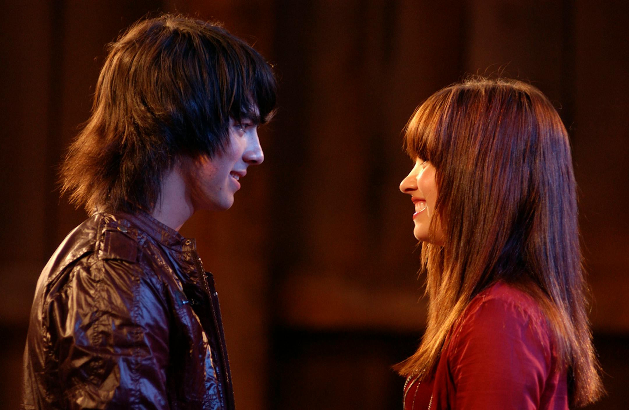 CAMP ROCK - "Camp Rock," a music-filled Disney Channel Original Movie, features the Jonas Brothers as members of a leading musical group, Connect 3. When member Shane Gray (Joe Jonas) needs to counter his bad boy rocker image, he is sent by his fellow band members Nate (Nick Jonas) and Jason (Kevin Jonas) to the music camp as a guest instructor. There he meets camper Mitchie Torres (Demi Lovato), a teen girl with an extraordinary voice and a driving ambition to be a pop singer but unfortunately she can only spend her summer at the expensive camp by helping her mom work in the mess hall between classes. When Shane overhears Mitchie singing from behind closed doors, he sets out to find the girl with the beautiful voice, when "Camp Rock" premieres on the ABC Television Network as a presentation of the "Wonderful World of Disney" on SATURDAY, JUNE 21 (8:00-11:00 p.m., ET). (ABC/DISNEY CHANNEL/JOHN MEDLAND) JOE JONAS, DEMI LOVATO