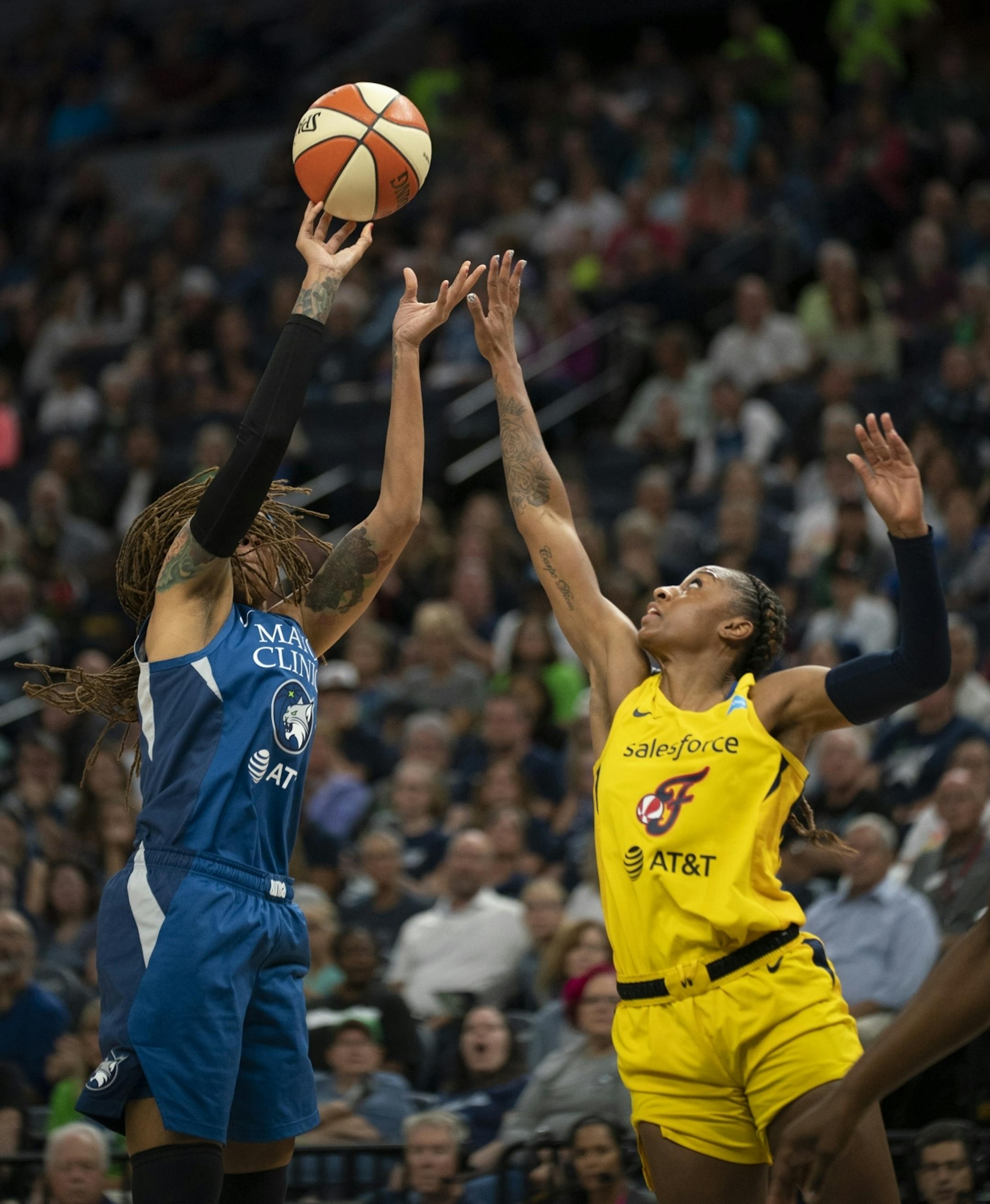 Minnesota Lynx guard Seimone Augustus (33) shot over the defense of Indiana Fever guard Tiffany Mitchell (3) in the second quarter.